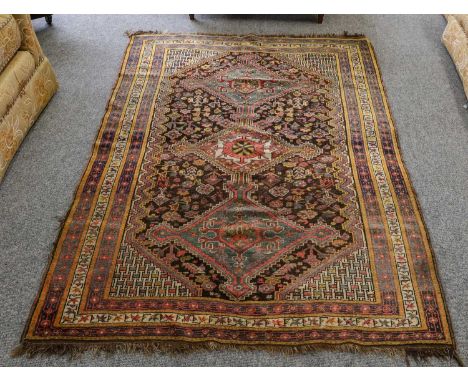 Khamseh rug, the charcoal field with three stepped medallions enclosed by triple borders 183cm x 133cmOne end is complete wit