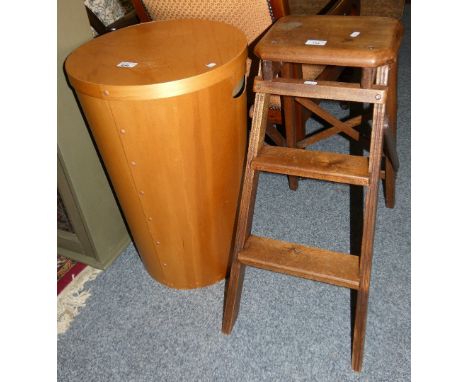 A mahogany folding set of step ladders and a laundry basket (2)