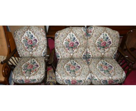 An Ercol 994 cottage two seater sofa and matching armchair with original upholstery (2)