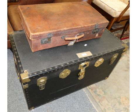 A large travelling trunk with brass fittings and a leather suitcase (2)