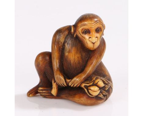 Japanese Edo period ivory netsuke, of a monkey holding a branch, signed and with two old collection labels, 3.5cm high