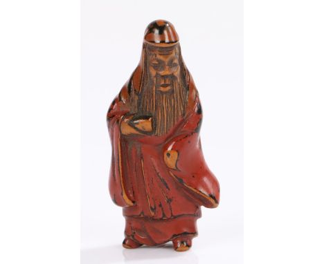 Japanese Edo period lacquered netsuke, of a standing figure with long robes, 5.2cm high