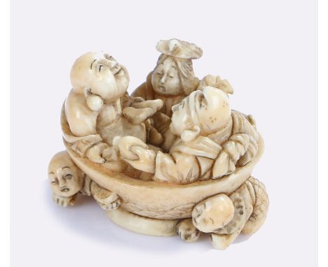 Japanese Edo period ivory netsuke, figures seated in a bowl playing instruments and drinking above two further figures, signe