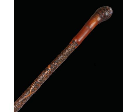 Japanese Meiji period walking stick, the root top above a smooth handle above a foliate and bird carved shaft, 90cm long