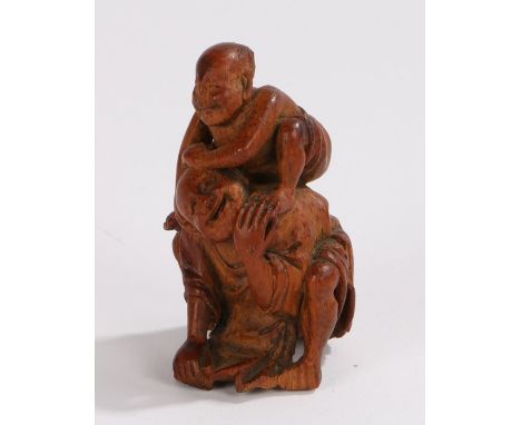 Japanese netsuke, a figure wrestling a figure below, 6.2 cm high