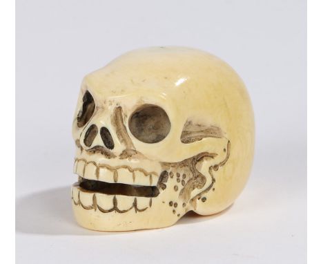 Japanese Meiji period ivory netsuke, carved as a skull, signed to the base, 30mm high