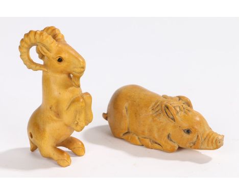 Two Japanese netsuke, of a boar lying down, signed to the base together with a goat in a raised stance, signed to the base, (