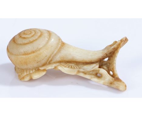 Japanese Meiji period bone netsuke, as a snail moving along a flower, 6.5cm 