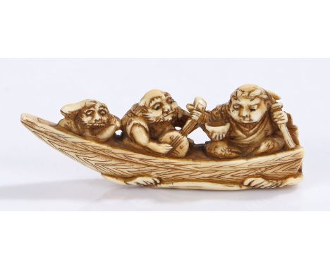 Japanese Edo period ivory netsuke, mythical figures playing instruments in a boat, 6cm long