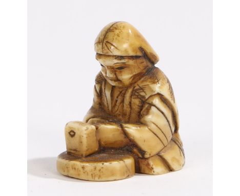 Japanese Meiji period ivory netsuke, of small proportions, of a seated figure, 2.5cm high