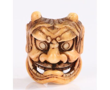 Japanese Meiji period ivory netsuke, of a Noh mask, 3.3cm high