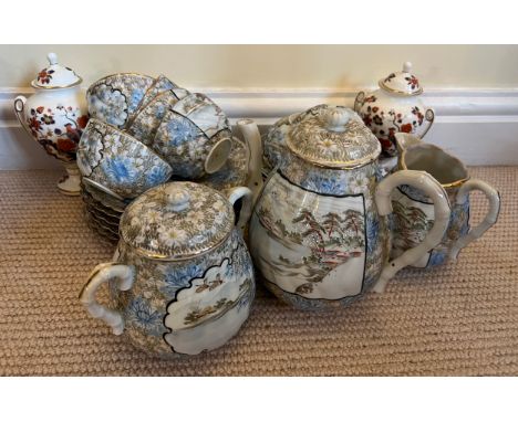 An early 20thC Japanese teaservice comprising 6 plates, 7 saucers, 7 cups, lidded sugar, milk and teapot, together with a pai