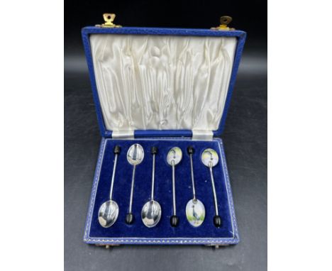 Set of 6 silver, 1960 maker Henry Clifford Davis, boxed coffee spoons with enamel backs to the bowl depicting a grey crowned 