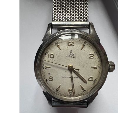 A 1950's Tudor Oyster stainless steel gentleman's wristwatch, gold numerals, gold hands and Rolex crown on stainless steel br
