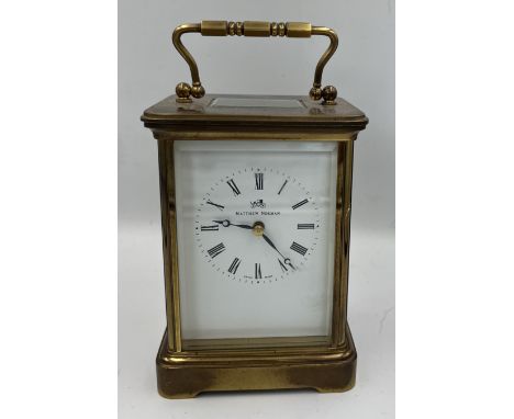 A brass cased Mathew Norman carriage clock with visible escapement. 13.5cm h. 