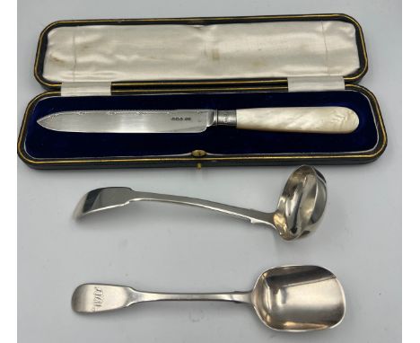 Silver to include toddy ladle Edinburgh 1841, cased mother of pearl handled cake knife Sheffield 1906 and a preserve spoon Lo