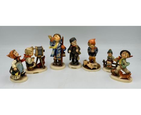 A quantity of Goebel Hummel figures, to include Hear-Ye Hear-Ye, Farm boy with pigs, The Photographer etc. (7). 