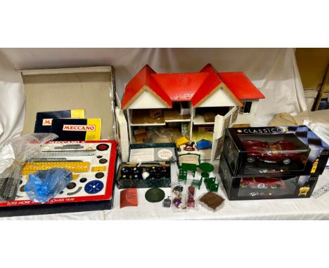 A miscellany of toys and games:  a vintage Triang dolls house and various contents to include three Grecon figures, Mattel be