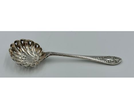 Silver sifting spoon Sheffield 1909 Walker &amp; Hall, 42gm.  Engraved with a K. 