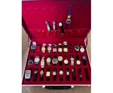 A large collection of watches in case to include Vostok Komandirskie Submarine USSR, Accurist Shockmaster, Limit Incabloc, TY