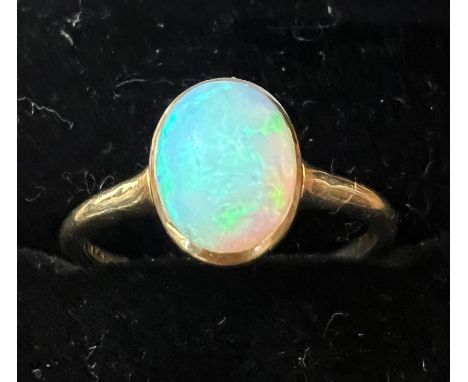 A 18 carat yellow gold ring set with opal. Weight 2.5gm. Size O. 