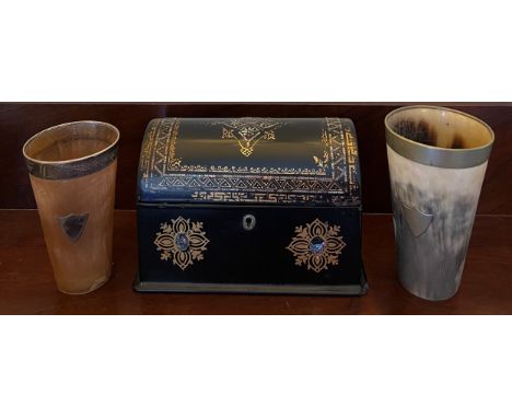 Two horn beakers, one with hallmarked silver mounts London 1895 and a Victorian dome topped papier mâché tea caddy with gilt 