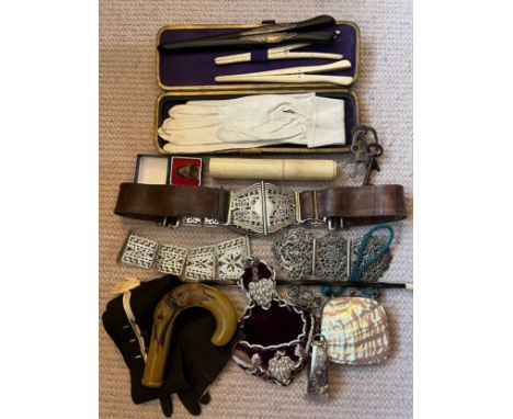 A miscellany to include leather and silver plated belt, plated belt buckle, kid gloves, ebony and silver mounted glove stretc