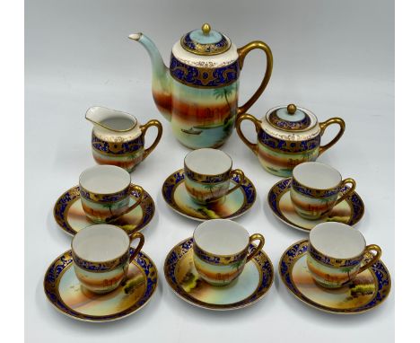 A Meito hand painted Noritake style fifteen piece coffee set complete with coffee pot, two handled sugar basin,  milk jug and