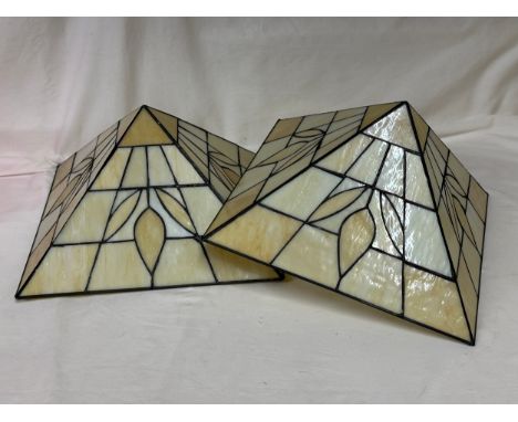 A pair of Tiffany style contemporary light shades in cream hues. Each 32 x 32cm and approx. 18cm deep. 