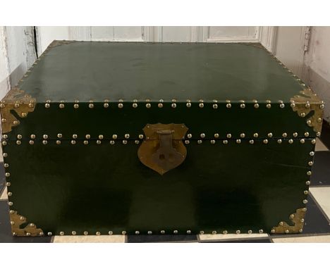 A green painted and brass mounted trunk, painted black to the interior. Measures 61cm l x 40cm d x 30.5cm h.