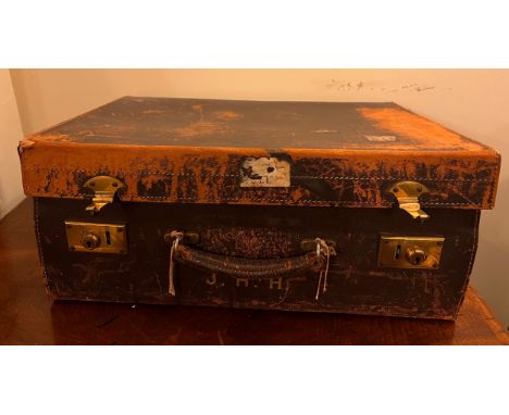 A vintage leather suitcase 52cm x 36cm x 18cm complete with four hallmarked silver lidded jars, London 1930/31 and ebony back