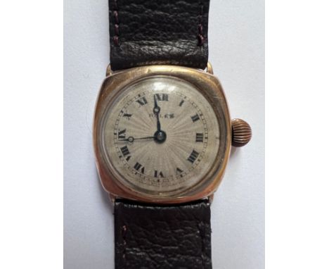 A 9ct gold vintage sunburst dial Rolex cushion wristwatch. Marked .375 to inner case. Case 27mm. Some light scratches and din