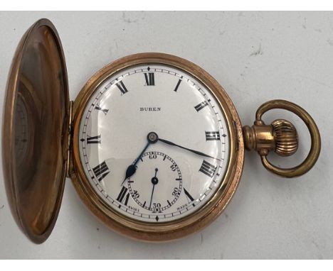 A Buren Swiss made full hunter gold plated pocket watch with white enamel dial and subsidiary seconds dial. 5cm w. 