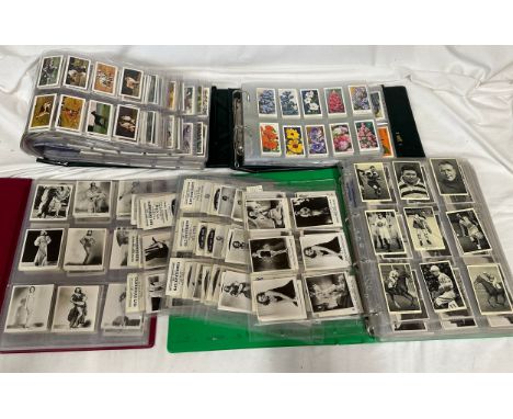 Four albums of cigarette cards to include: Carreras Ltd 'Film Stars'(216), 'Film and Stage Beauties' (50) Wills 'British Spor