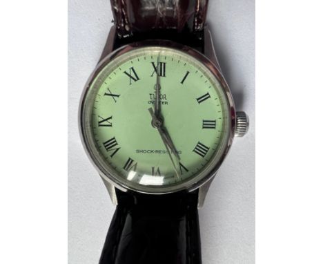 A 1940's gentleman's Tudor Oyster Shock Resisting wristwatch on brown leather strap and green dial. Case 31mm. Stamped to bac