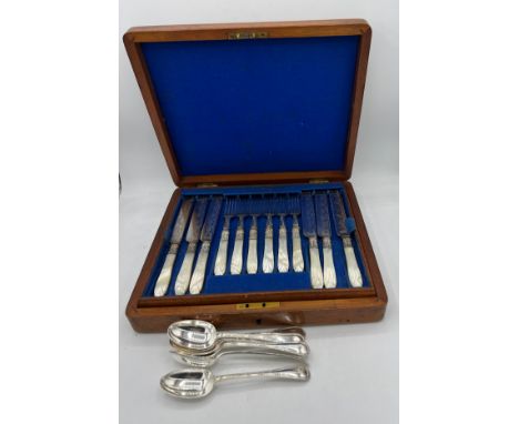 A mahogany cased 12 place dessert service with mother of pearl handles together with six plated teaspoons. 