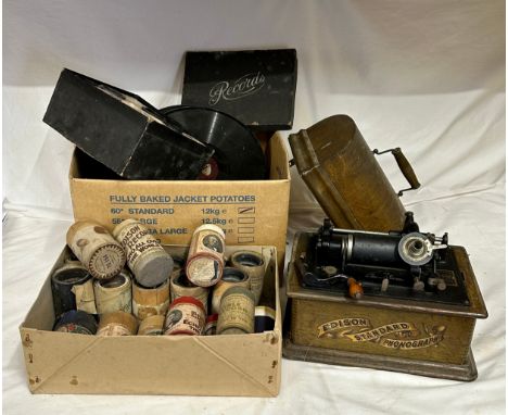 An Edison standard phonograph in an oak case, serial no. 587322, with winding handle, 31cm w, sold with a quantity of wax cyl