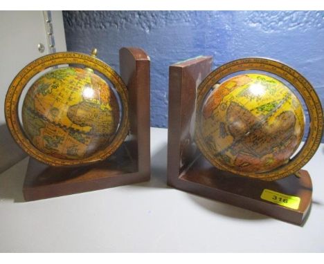 A pair of reproduction globe bookends 