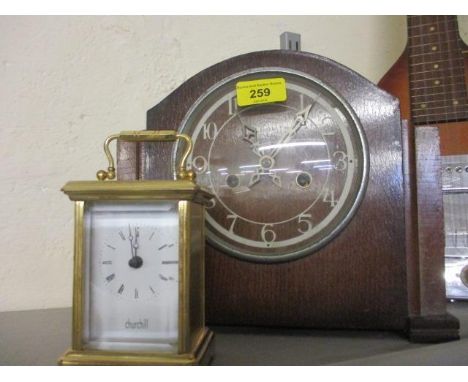 A mid 20th century Enfield oak cased mantel clock, together with a Churchill brass carriage clock 