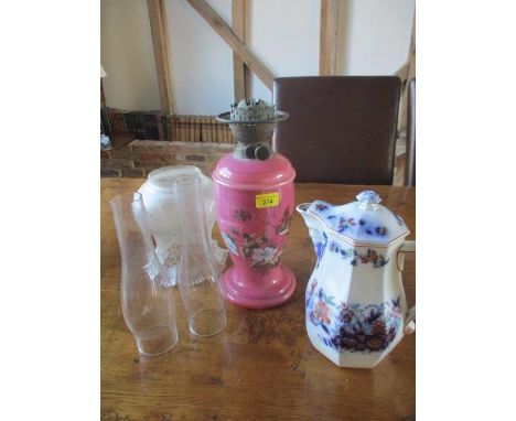 A Victorian painted pink glass oil lamp with etched glass shade and two glass funnels, together with a Davenport glazed jug a