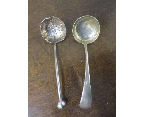 A silver sifter spoon and a sauce ladle 