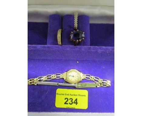 Three 9ct gold rings to include an amethyst ring and a 9ct gold cased ladies wristwatch 