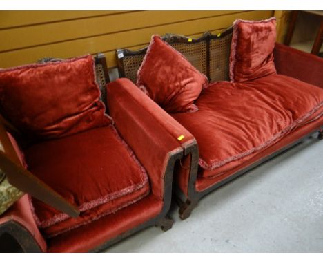 Early twentieth century cane backed salon part-suite comprising two-seater sofa & single chair in red velvet upholstery