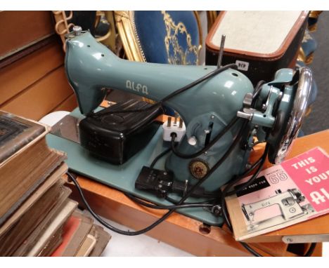 A vintage cased Alfa model 65 electric sewing machine E/T