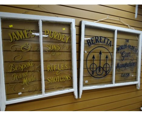 Two vintage sash windows with advertising for rifles & shotguns