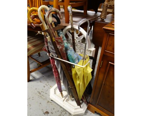 A painted white cast iron stick / umbrella stand & contents of umbrellas