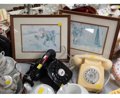 Two vintage BT telephones (one black, one cream) together with two framed prints