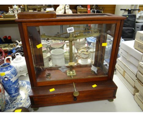 A cased chemist shop weighing scales together with a Morse code communicator