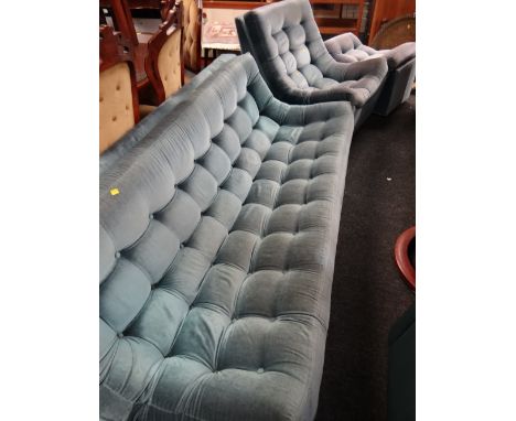 A 1970s retro pale blue velvet button backed three-piece suite together with a similar recliner