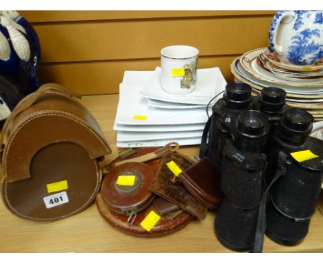 A pair of vintage Prinz binoculars together with a pair of Panorama vintage binoculars, vintage leather bound tape measures &
